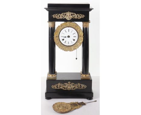 A late 19th/early 20th century German four pillar mantle clock by F.M.S (Friedrich Mauthe Schwenningen), white enamel face wi