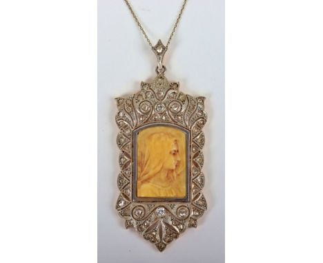 A Continental 18ct gold and diamond religious pendant, central ivory portrait of Mary in decorative surround set with fifty e