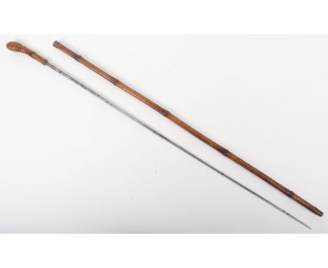 A Victorian bamboo sword stick, the blade marked Solingen, blade 76cm