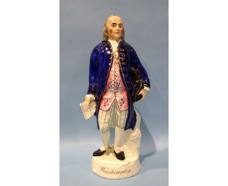 A Staffordshire pottery figure of George Washington, modelled standing, holding a hat and a scroll, wearing trousers with gil