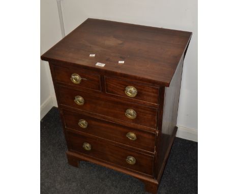 A George III mahogany commode/bachelors chest, of two short and three long graduated cockbeaded drawers, bracket feet. c.1800