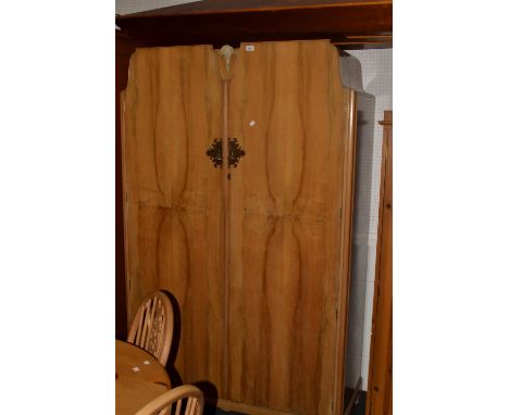 A mid 20th century  light walnut bedroom suite, comprising double door wardrobe and dressing table