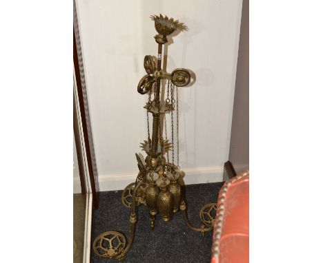 A Victorian brass adjustable three branch rise and fall light fitting,  cast with bosses and scrolling acanthus, three balanc