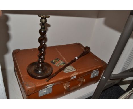 A mid 20th century leather effect suitcase;  an oak barley twist candlestick;  a knobkerrie