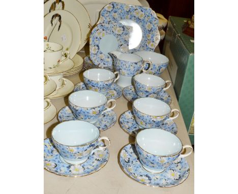 A Shelley tea service, pattern number 823343, with white chrysanthemums on a pale blue ground, comprising of sandwich plate, 