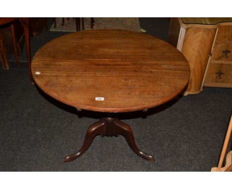 A George III mahogany circular occasional table, baluster column, tripod legs, pad feet, c.1760