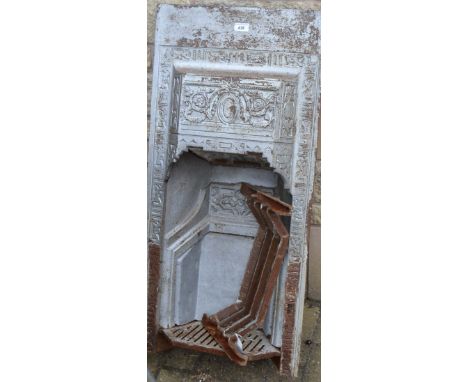 A cast iron fire surround, cast with flowers and leaves 