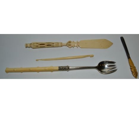 A Victorian silver plate fork, carved ivory handle as a branch;  a carved bone paper knife, button hook etc (5)