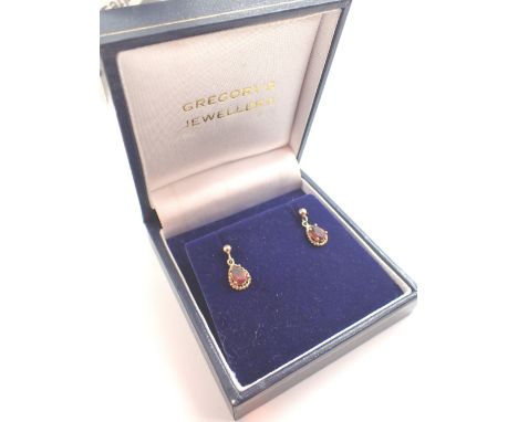 Pair of 9ct gold ruby earrings CONDITION REPORT: Cannot confirm natural rubies. 7mm x5mm