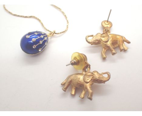 Gold plated enamel effect egg pendant on gold plated chain and a pair of gold plated elephant earrings