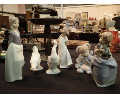 Six Nao figurines including two geese