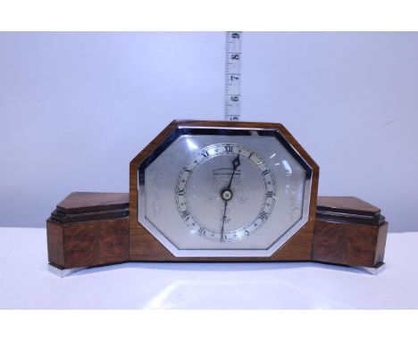 A Art Deco period Walnut cased mantle clock 