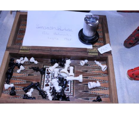 A vintage chess travelling set and 1940's table lighter 