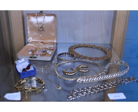 A shelf full of costume jewellery 