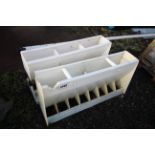 2x plastic pig feeders.