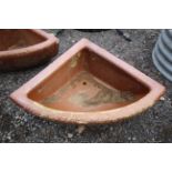 A quarter glazed stoneware horse feed bowl