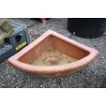 A quarter glazed stoneware horse feed bowl