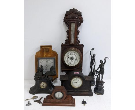 Two mantel clocks, both faced with an Arabic dial, one with a chariot on top two figures, one labelled "Le Commerce" and the 