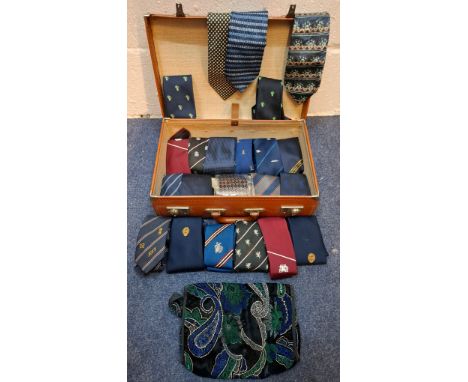 A vintage brown leather weekend suitcase containing vintage ties, mainly club ties to include a P&O Ferries SS Canberra tie. 