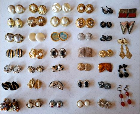 Givenchy- A pair of 1980's gold tone clip on earrings with central faux pearl flanked by copper coloured crystals together wi