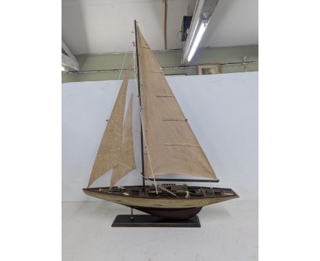 A model of a sailboat on a plinth 100cm h x 76cm w Location:If there is no condition report shown, please request