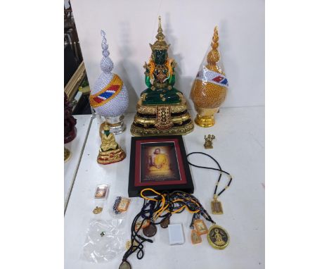 Buddhist related items to include a glass and ceramic model of the meditating Gautama Buddha, various pendants and other item