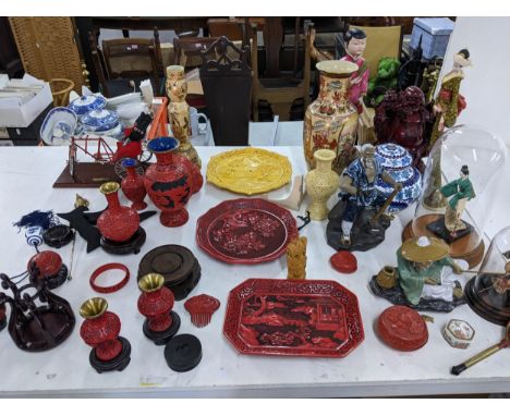 Asian related ornaments to include various Chinese Cinnabar style lacquered items, an Oriental Rickshan model on a plinth, a 