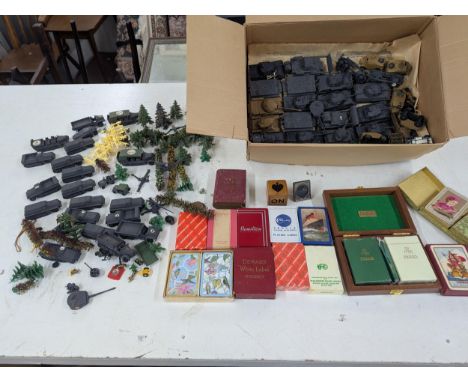 A mixed lot to include WW2 model tanks and miniatures, together with a small collection of various playing cards Location:If 