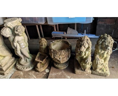Mixed garden stoneware ornaments to include a pair of lion statues, small planter, garden gnome and a figural standLocation: 