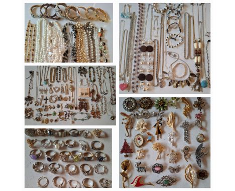 A quantity of costume jewellery to include bangles, a multi strand pearl necklace A/F with silver clasp, an Aurora Borealis n