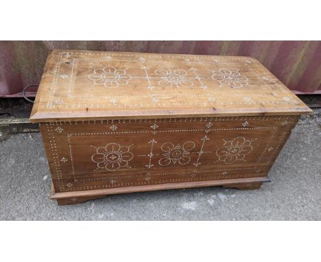 A Middle Eastern twin handled coffer inlaid with mother of pearl with stylized geometric motifs 51cm h x 104cm w Location: R 