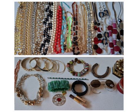 A quantity of mainly late 20th Century necklaces and bracelets to include 1980's gold tone chains, a coral necklace, gold ton