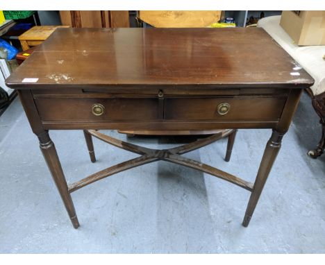 A reproduction mahogany two drawer side table with writing slide having inset leather scriber, above two drawers with ring ha