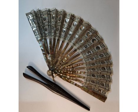 A mesh ground and lace trimmed fan decorated with silver coloured sequins having 2 mother of pearl guards and 16 wands togeth