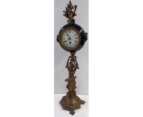 An early 20th century French figural pillar clock in the form of a spelter maiden holding aloft the drum shaped clock 69.5cm 