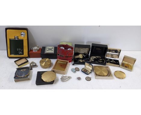 A mixed lot to include ladies and gents watches, costume jewellery, desk clock, compacts, badges and other itemsLocation:If t