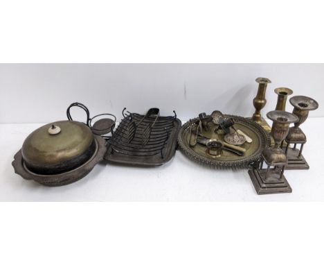 A small collection of metalware to include some silver plated items, two pairs of candlesticks, a pair of tongs and other ite