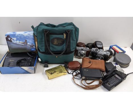 A mixed lot to include a cased set of boules, telephones and cameras to include a Canon FX, Kodak Retinette and othersLocatio