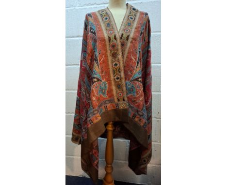 A modern paisley shawl having a brown border with terracotta, blue, yellow and brown colour-way, approx 125cm x 225cm. Locati