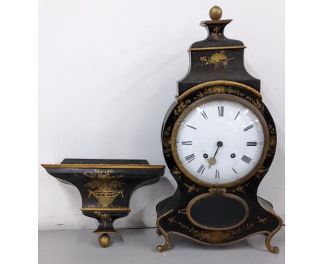 A 19th century Swiss bracket clock, black lacquered and both the clock and bracket decorated with gilt floral motifs, the mov