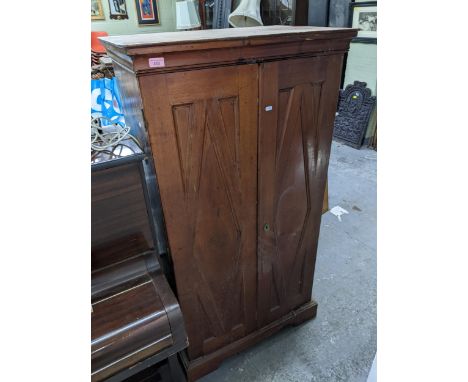 An early 20th century wooden two door cabinet, panelled front, internal shelves, on bracket feet, 141 x 75 x 49cmsLocation: G