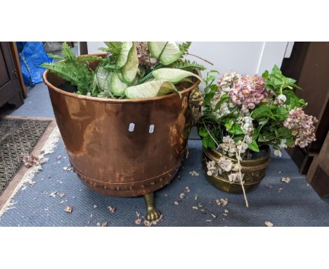 A Victorian copper and brass log/coal bin having lion ring handles and raised on lion paw feet 45cm h x 49cm w, together with