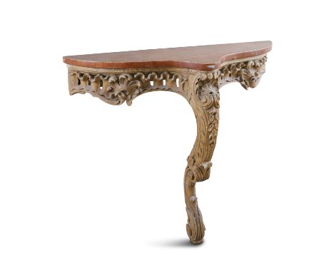 A 19TH CENTURY CARVED WOOD CONSOLE TABLE, with faux marble top above leaf carved and pierced apron, raised on cabriole monopo