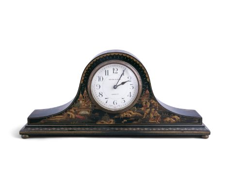 A BLACK AND GILT LACQUERED CHINOISERIE DECORATED MANTLE CLOCK, by Kendal and Dent, London. 35cm long x 16cm high 
