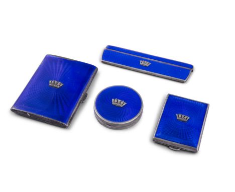 A SUITE OF BLUE ENAMEL MOUNTED SILVER BIJOUTERIE, comprising a rectangular vesta case; a comb and holder; a circular powder c