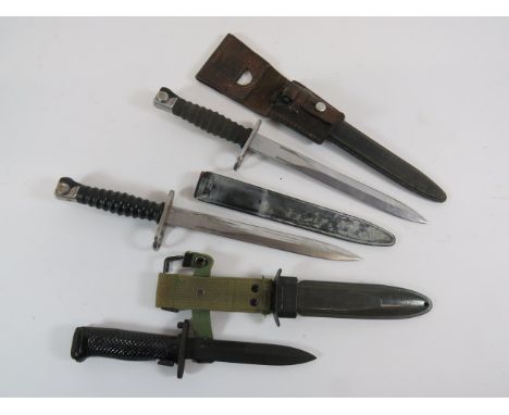 Three Various Bayonetsconsisting US M8A1 bayonet.  Single edged blade.  Steel crossguard and flat pommel.  Black composite ch