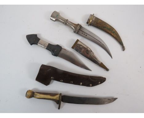 Three Various Knivesconsisting field made example.  7 inch, single edged, clipped point blade.  Brass crossguard.  Antler gri