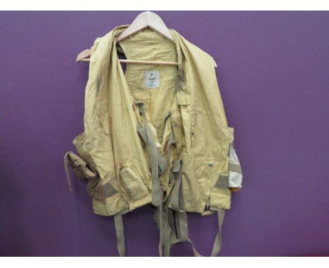 1941 Pattern RAF Mae Westyellow drill material vest.  Tan canvas light pocket to the right side.  Left chest mirror pocket.  
