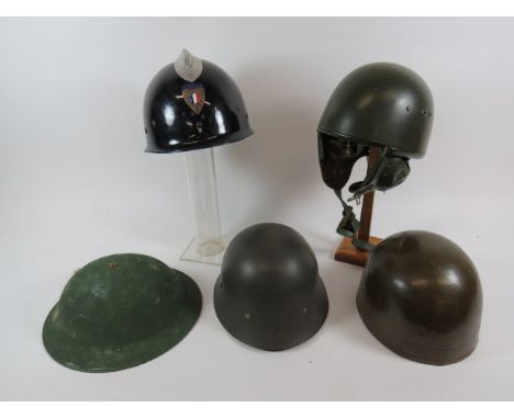 Small Selection of Various Helmetsconsisting British MKII steel helmet.  Repainted green ... 1951 French fibre Dispatch helme