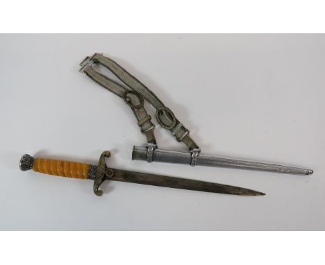 German Third Reich Army Officer's Dagger and Hanging Straps10 inch, double edged blade.  Plated crossguard and central eagle 